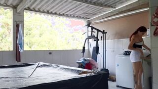 Woman in underwear does laundry outdoors