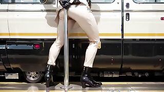 Elegant figure in beige suit by vintage train door