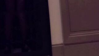 Elegant figure in sheer stockings captivates hotel lobby
