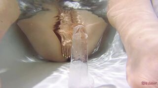 Plays with a Dildo Underwater